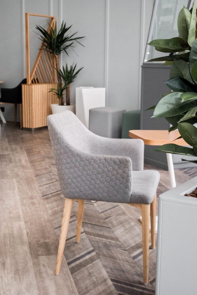 fashionable-modern-gray-chair-with-wooden-legs-ottoman-interior-furniture-interior-items-modern-designer-chair-stylish-minimalist-interior(1)